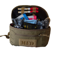 Interior of olive green MED first aid pouch packed with trauma supplies including Celox, Israeli 6", and Vented Chest Seal